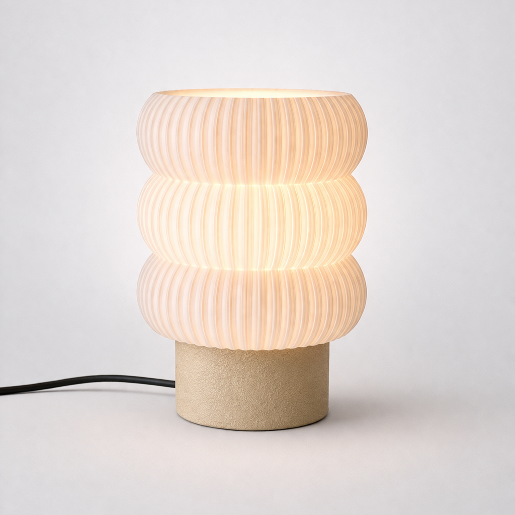 Table lamp with ribbed design and cardboard base on a white Sri Lankabackground